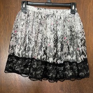 Juniors medium skirt with white slip and black lace decoration. Great condition